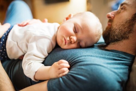 baby sleeping on father's chest